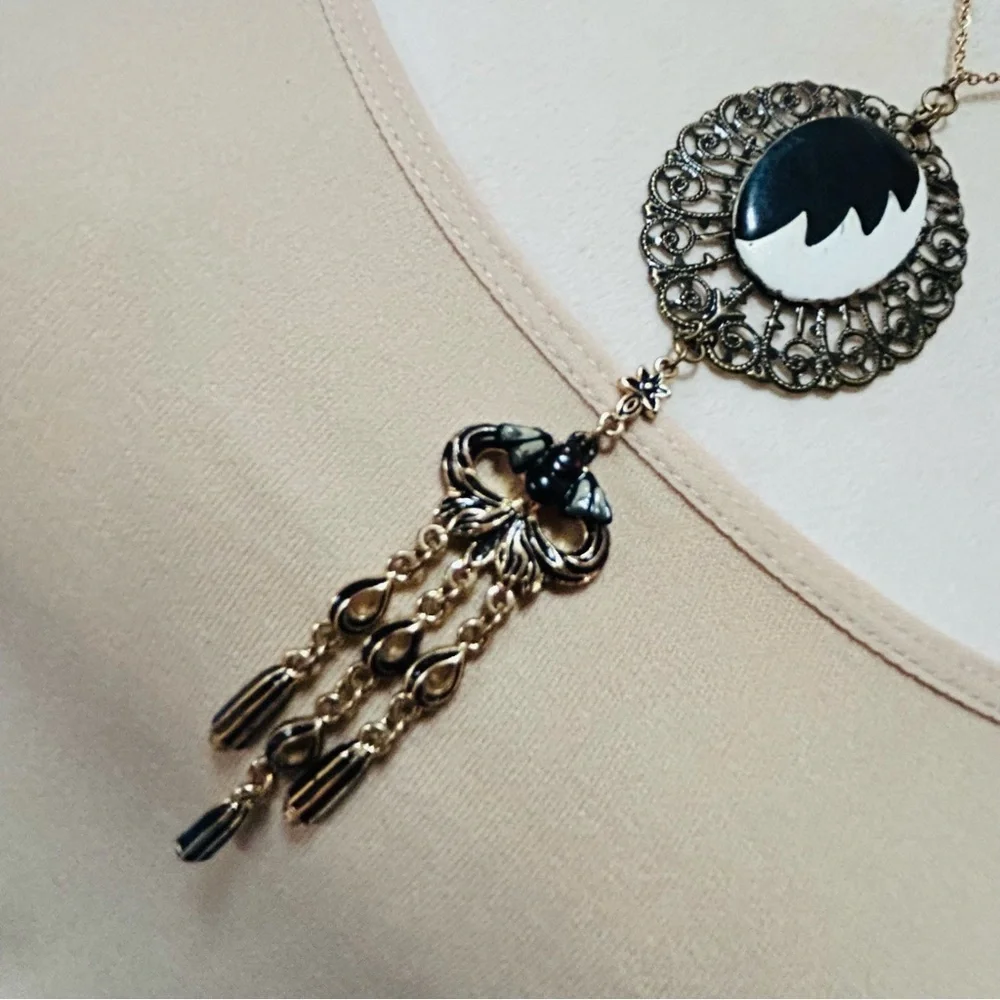 Handcrafted Cruella de Vil cameo bat accent pendant on chain necklace